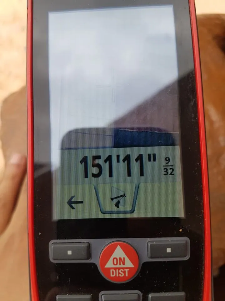 Leica DISTO S910 display reading 151 feet 11 9/32 inches.